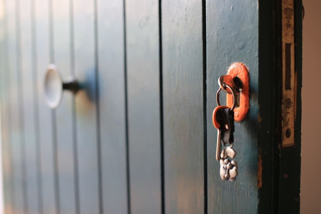 House keys hanging in a residential door lock