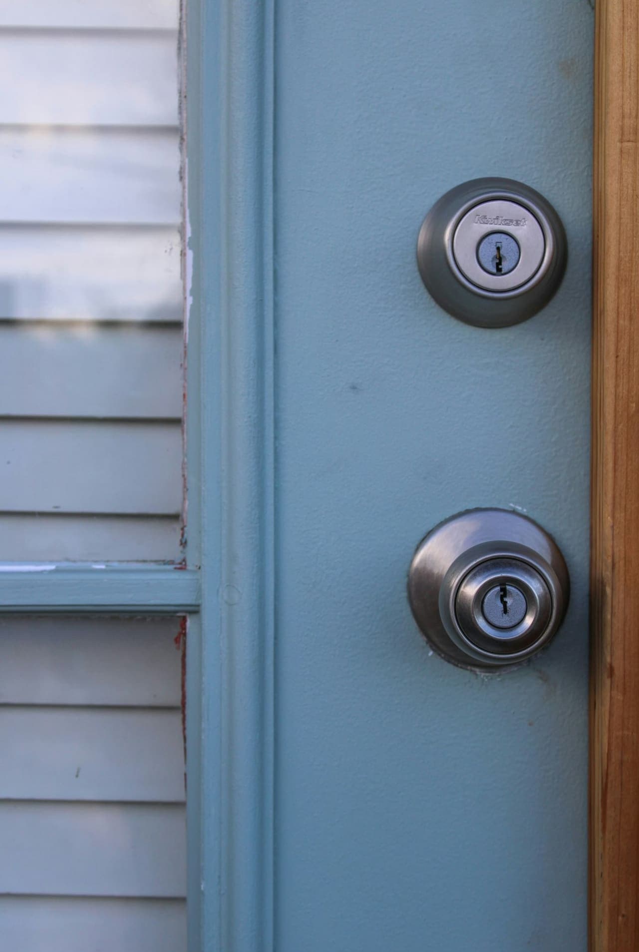 Door edge with deadbolt and latch cylinders during lock installation
