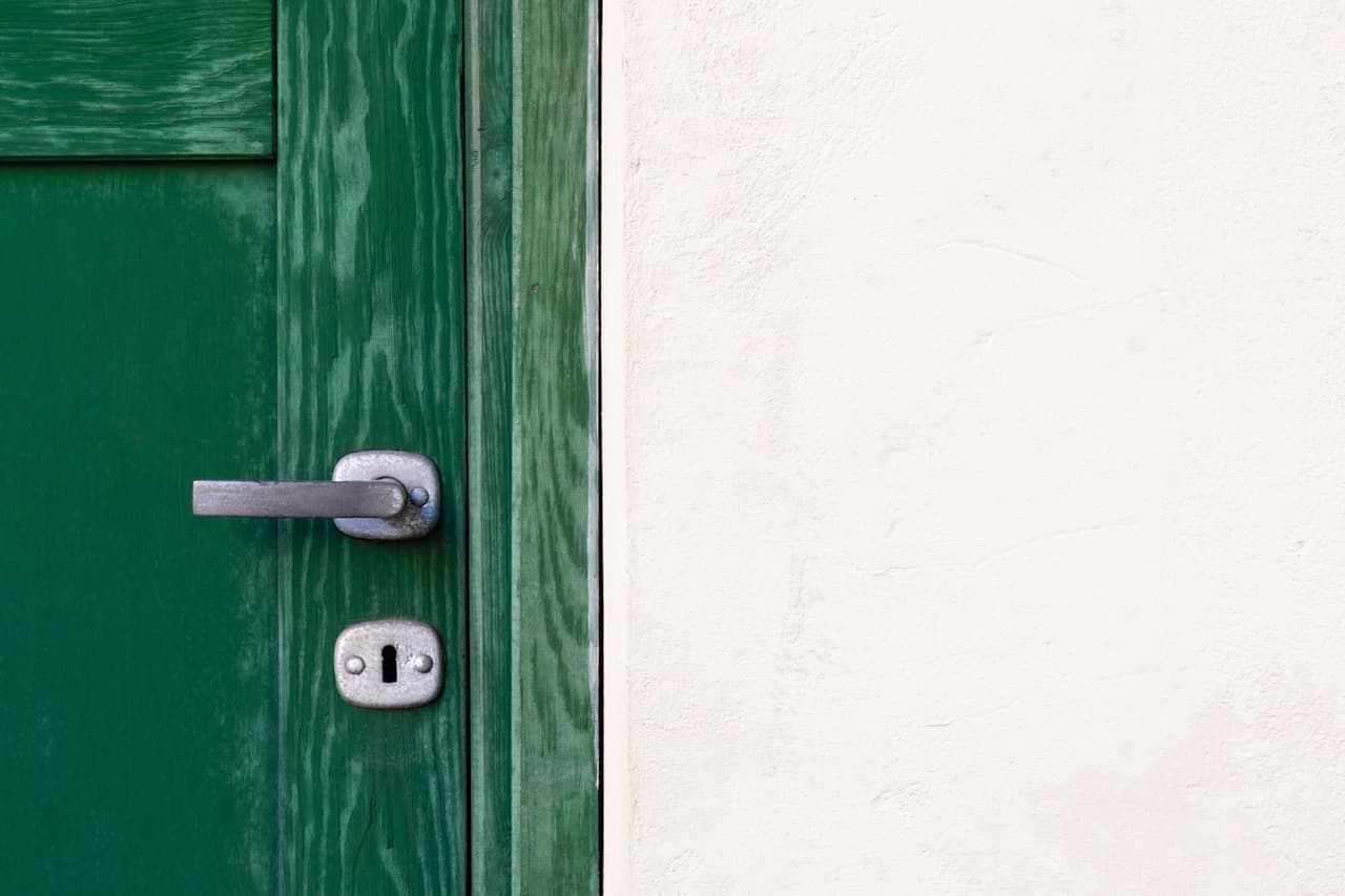Residential front door with a modern lever handle and deadbolt